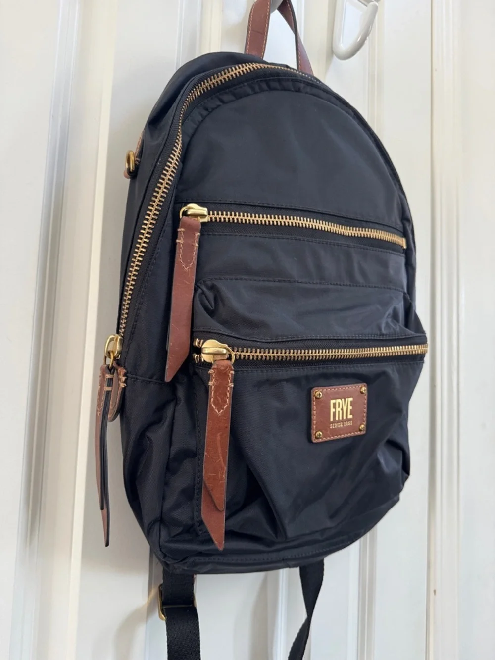 Frye Black Backpack with Brown Leather Accents and Gold Hardware